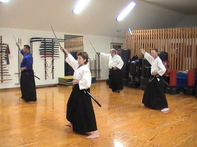 Group sword training in a dojo